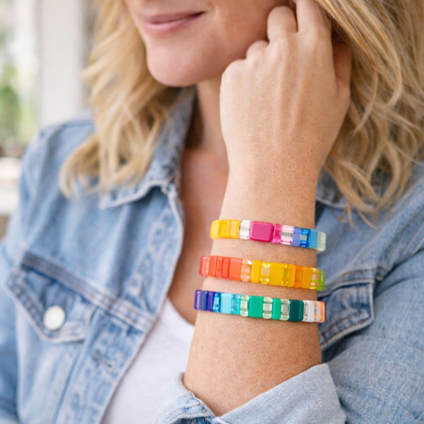 Stretch bracelet set worn stacked on wrist showing color variety