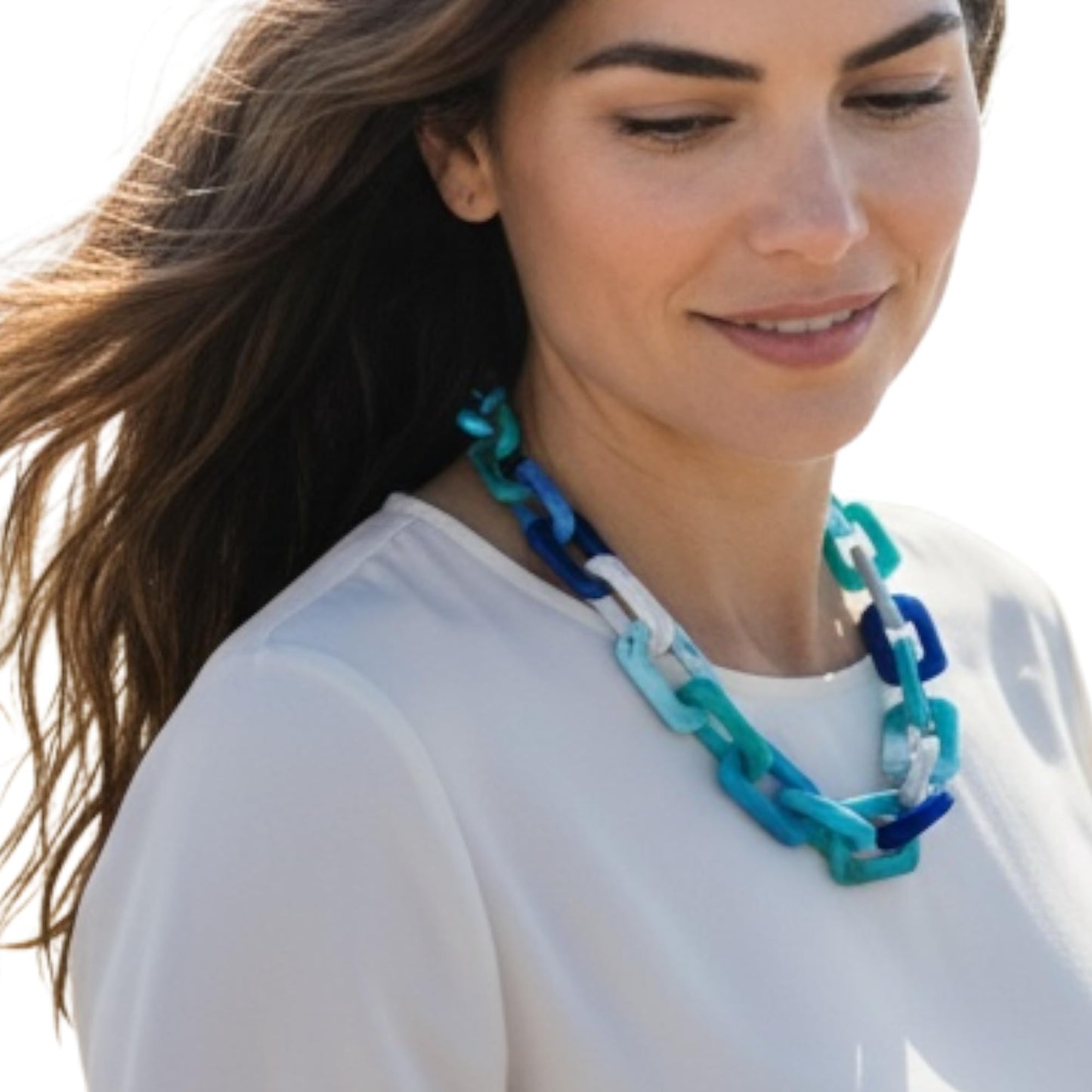 Oversized chain link necklace worn as statement piece