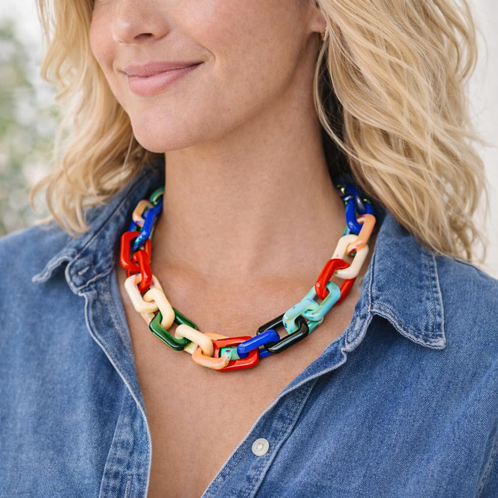 Oversized acrylic chain necklace worn on model showing statement size