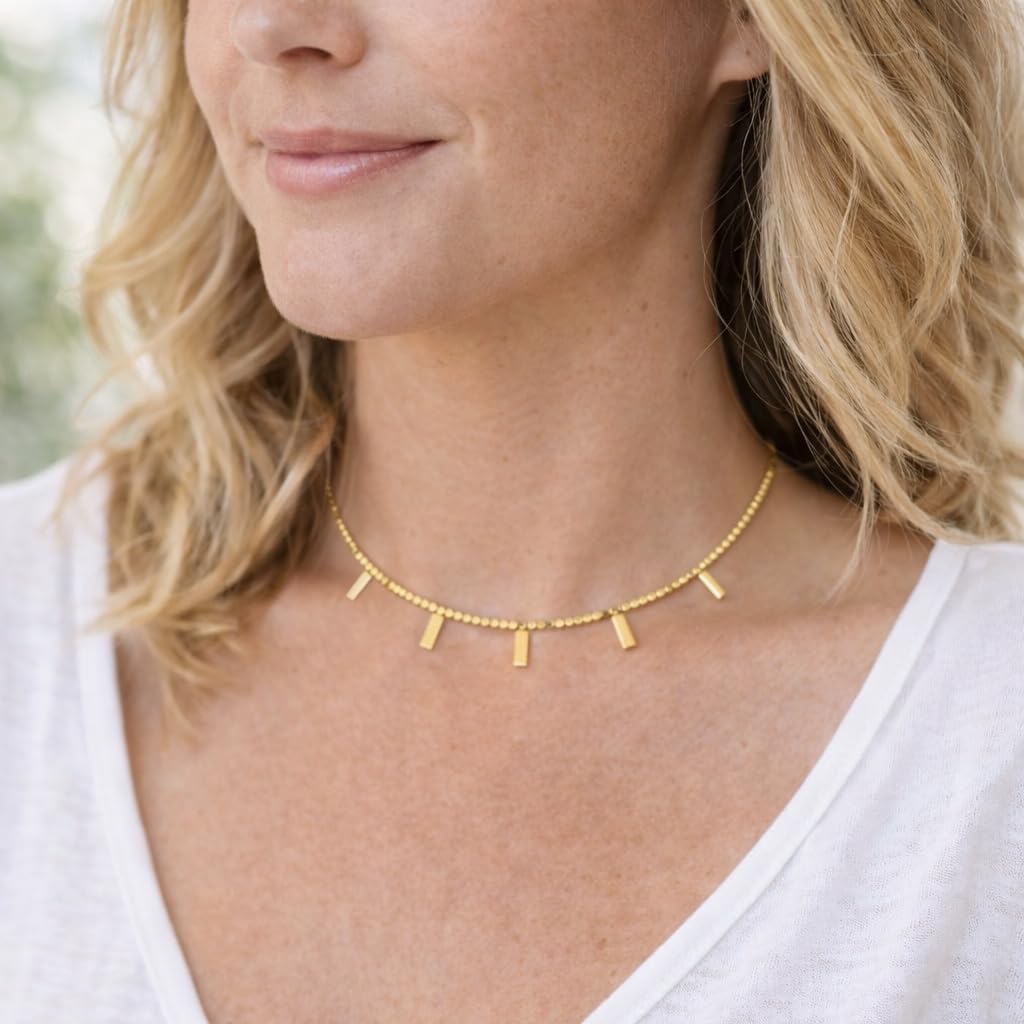 Luxe gold bead necklace worn for everyday elegant style