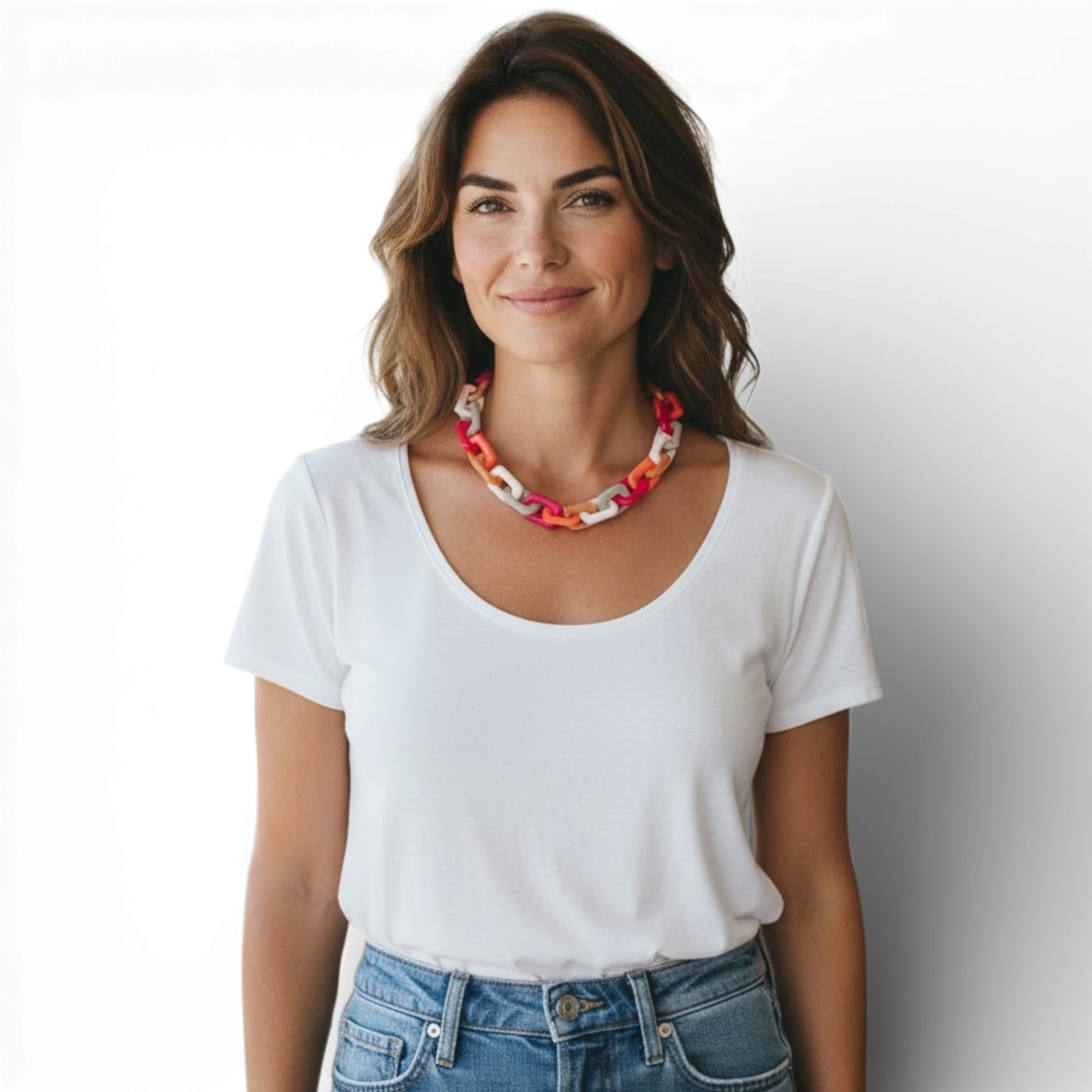 Colorful acrylic chain necklace flat lay on white
